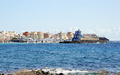 Marina del Sur with boats and colorful buildings, Las Galletas, Tenerife, Spain.