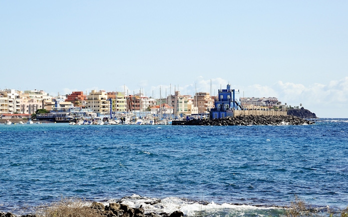 Marina del Sur with boats and colorful buildings, Las Galletas, Tenerife, Spain.