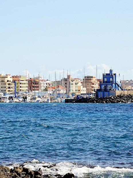Marina del Sur with boats and colorful buildings, Las Galletas, Tenerife, Spain.