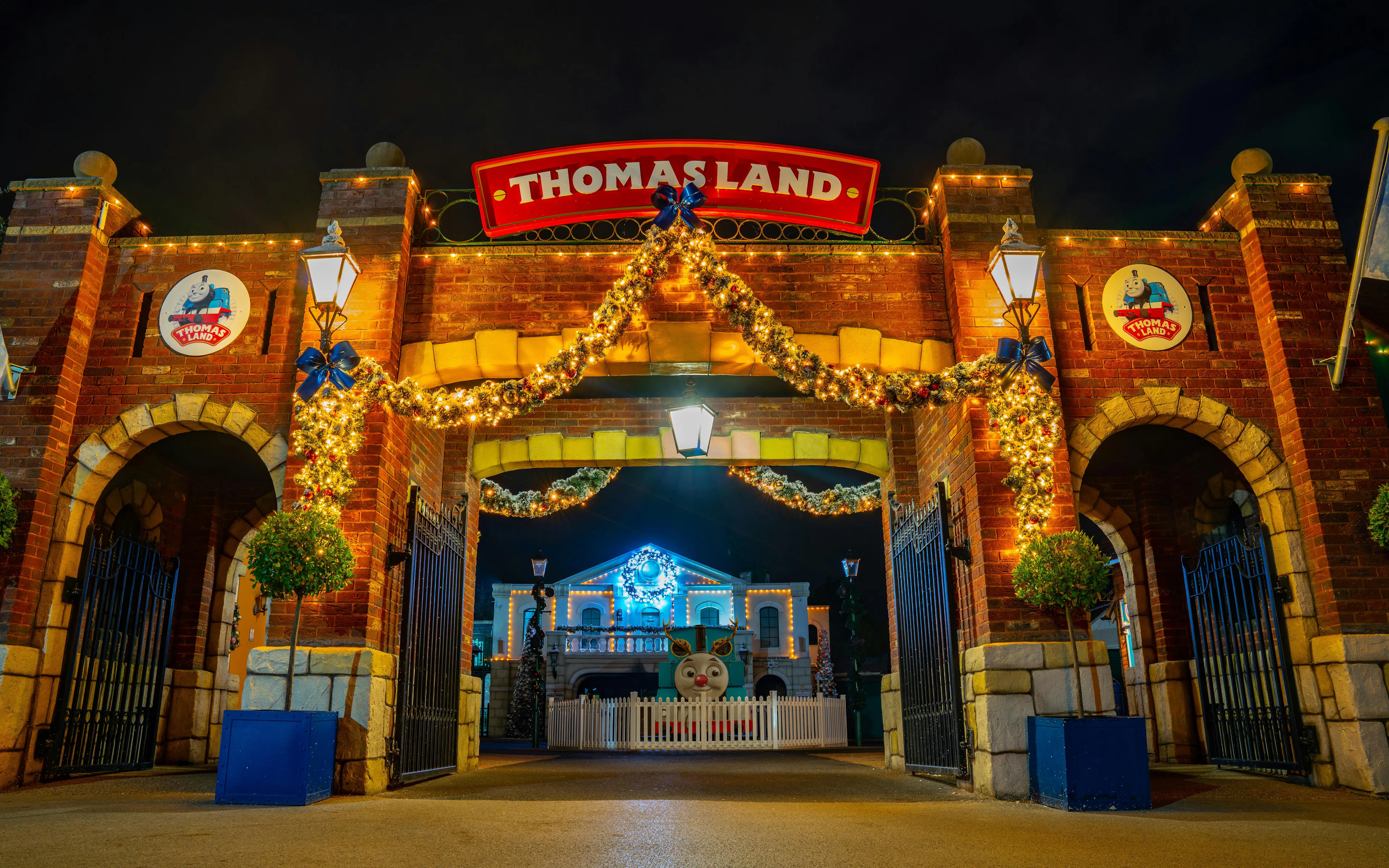 Entrance to Thomas Land at Drayton Manor, decorated with festive lights and garlands.