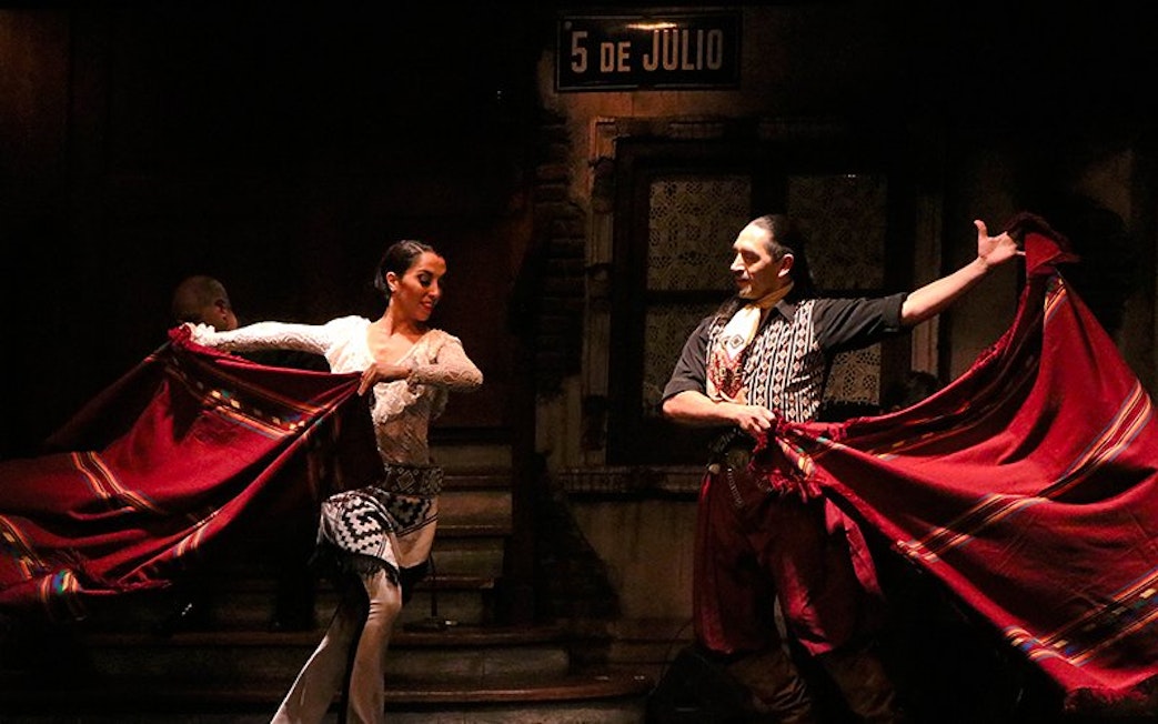 Tango dancers performing at Aljibe Tango Show in Buenos Aires.