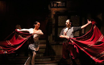 Tango dancers performing at Aljibe Tango Show in Buenos Aires.