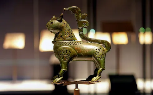 Bronze lion sculpture at Light & Peace Museum, Sheikh Zayed Grand Mosque Centre.