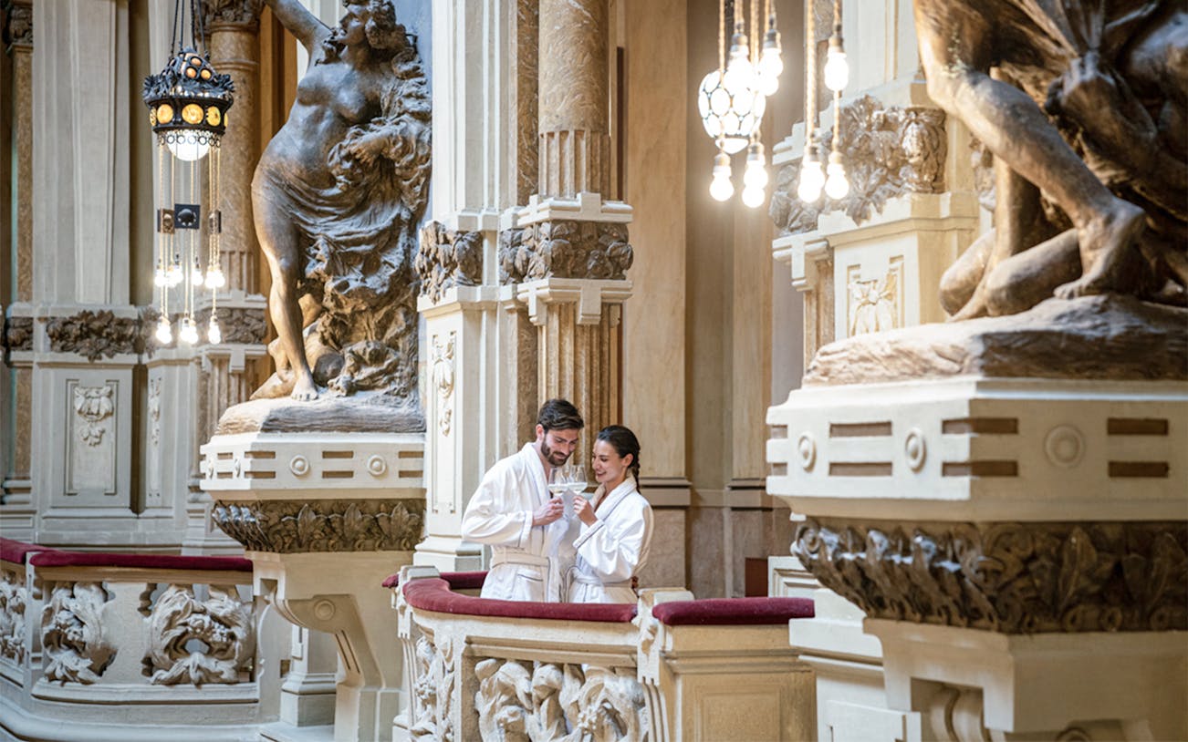 Couple enjoying drinks at QC Terme San Pellegrino Resort & Spa, Bergamo.