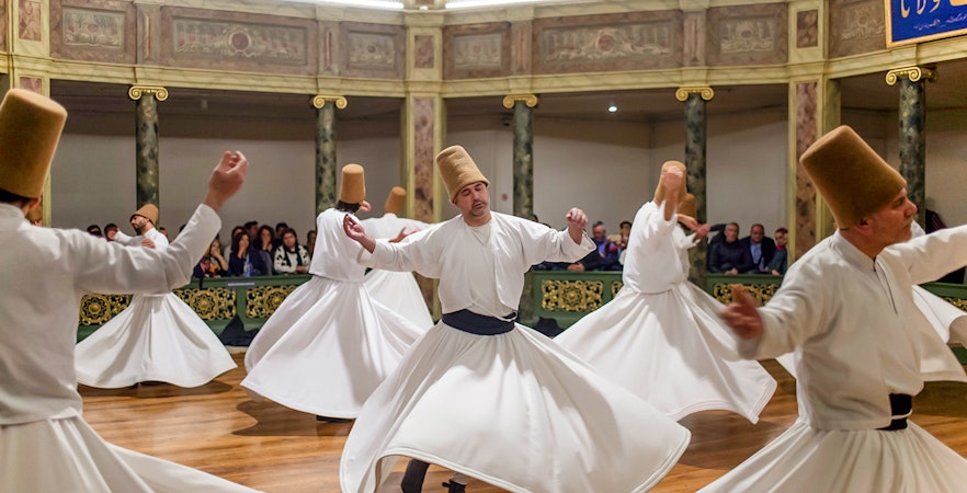 Whirling Dervish dancer in traditional attire performing in Istanbul, Turkey.