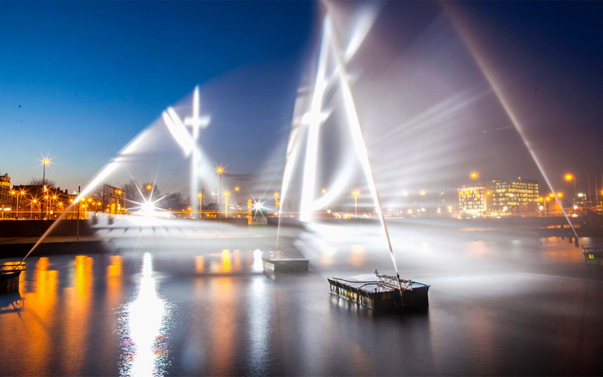 Amsterdam Light Festival installations illuminating the canal at night.