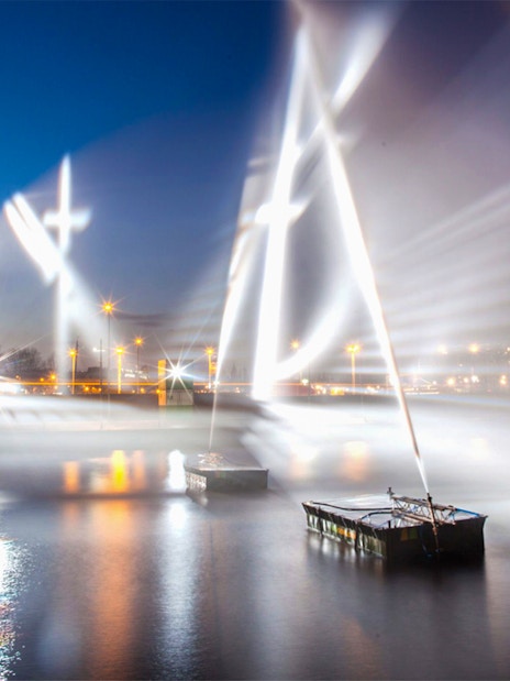 Amsterdam Light Festival installations illuminating the canal at night.