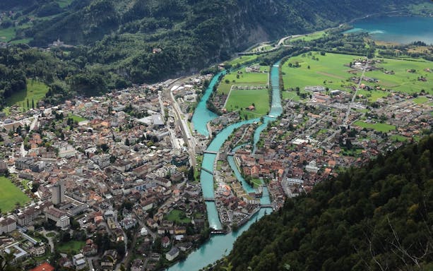 Aerial view of Interlaken with rivers and mountains, part of the Jungfraujoch tour from Basel.