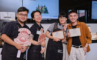 Participants holding certificates at a Vietnamese coffee workshop in Hồ Chí Minh City.