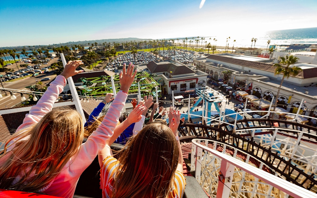 Roller coaster ride at Belmont Park, San Diego, overlooking the ocean and amusement area.