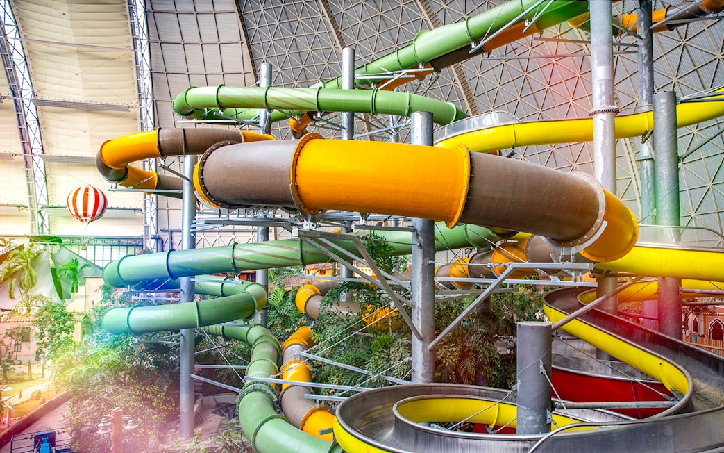 Colorful water slides at Tropical Islands Resort, Germany.
