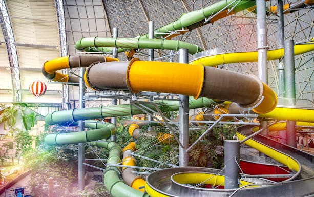 Colorful water slides at Tropical Islands Resort, Germany.