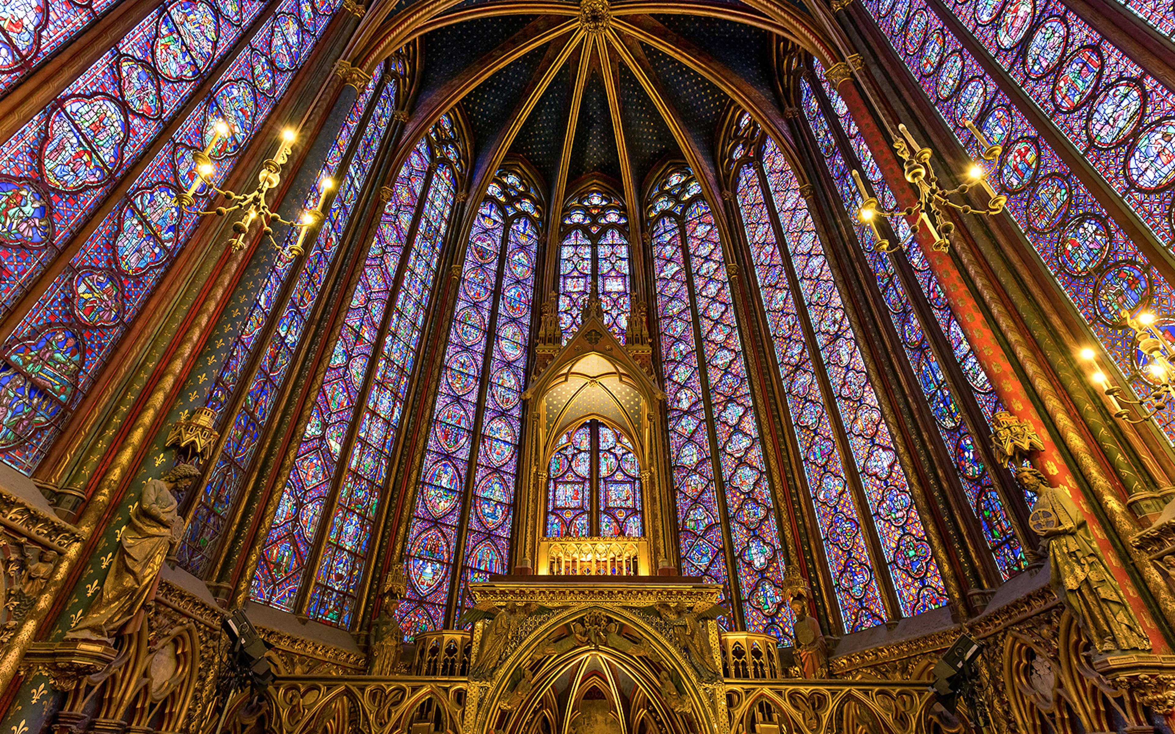 Stunning view of the vibrant Sainte Chapelle stained glass windows, a unique feature of the Paris day tour