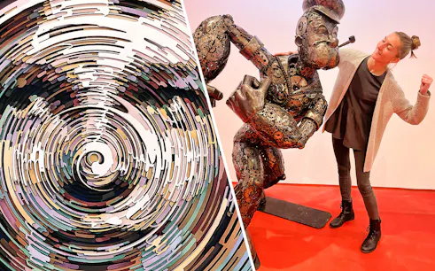 Illusion Art Museum Prague spiral artwork and visitor with steel figure.