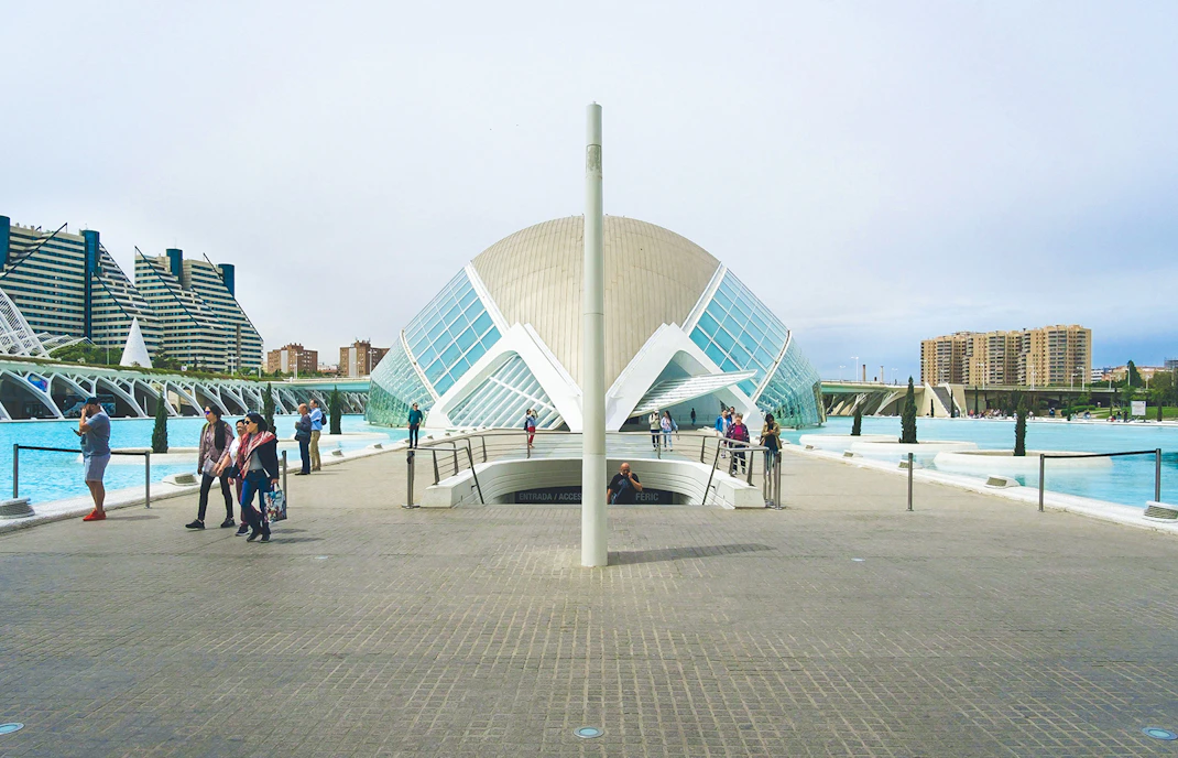 Hemisfèric building with visitors at City of Arts and Sciences, Valencia.