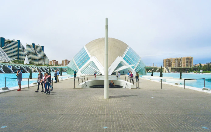 Hemisfèric building with visitors at City of Arts and Sciences, Valencia.