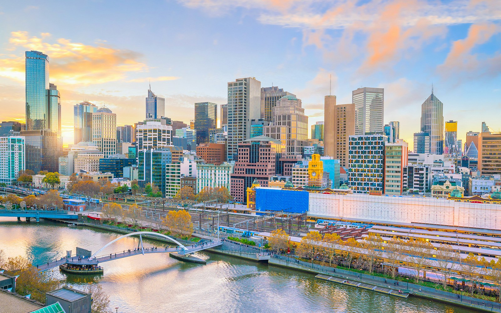 Melbourne skyline with Yarra River and Flinders Street Station in view.
