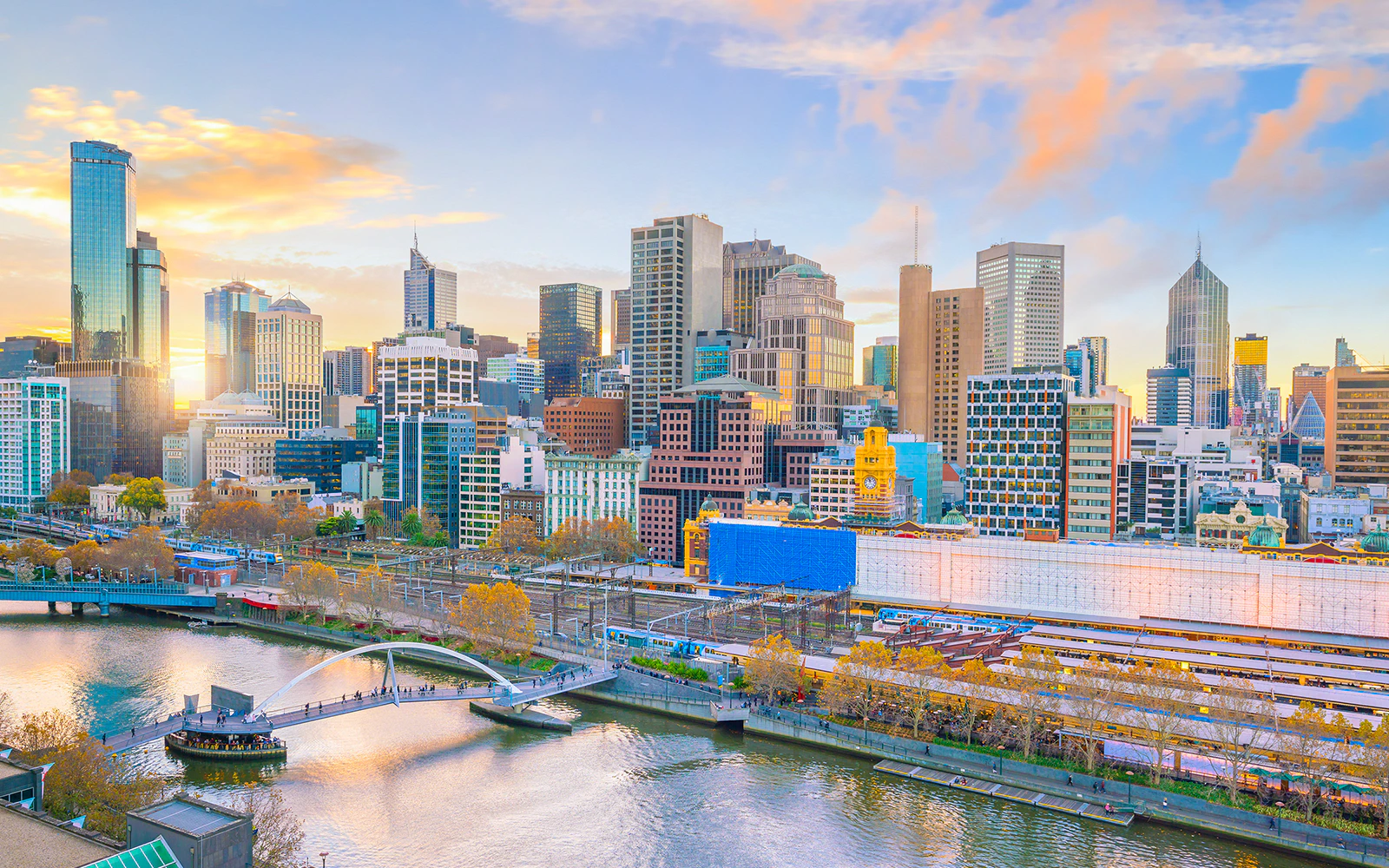 Melbourne skyline with Yarra River and Flinders Street Station in view.
