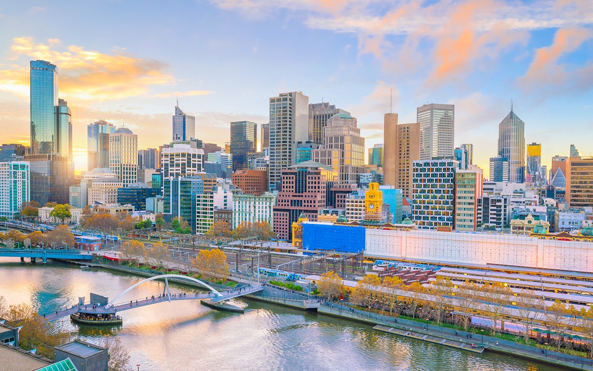 Melbourne skyline with Yarra River and Flinders Street Station in view.