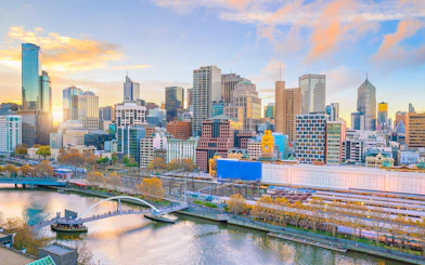 Melbourne skyline with Yarra River and Flinders Street Station in view.