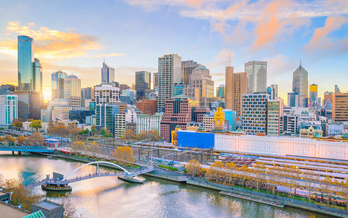 Melbourne skyline with Yarra River and Flinders Street Station in view.