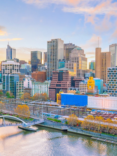 Melbourne skyline with Yarra River and Flinders Street Station in view.