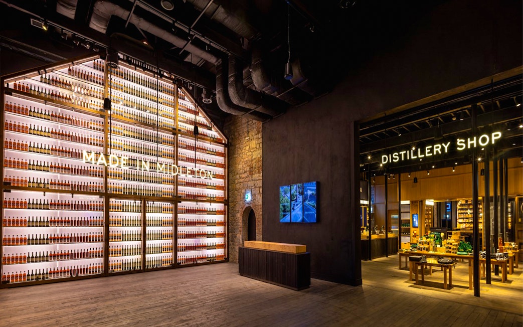 Midleton Distillery interior with bottle display and distillery shop entrance.