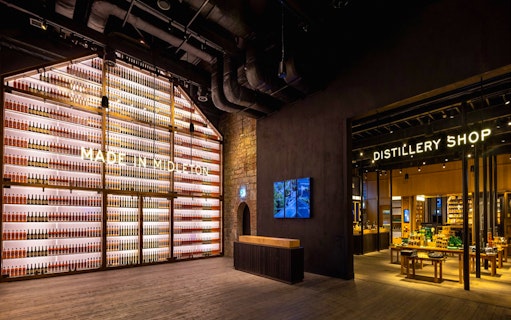 Midleton Distillery interior with bottle display and distillery shop entrance.