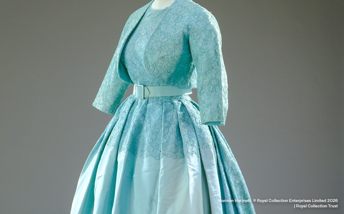 Ensemble designed by Norman Hartnell for Princess Margaret's wedding, featuring lace and satin.