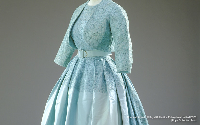 Ensemble designed by Norman Hartnell for Princess Margaret's wedding, featuring lace and satin.