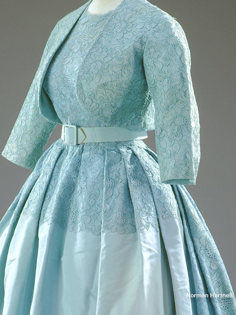 Ensemble designed by Norman Hartnell for Princess Margaret's wedding, featuring lace and satin.