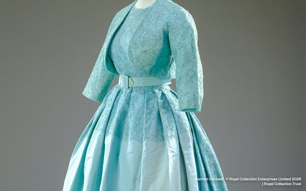 Ensemble designed by Norman Hartnell for Princess Margaret's wedding, featuring lace and satin.