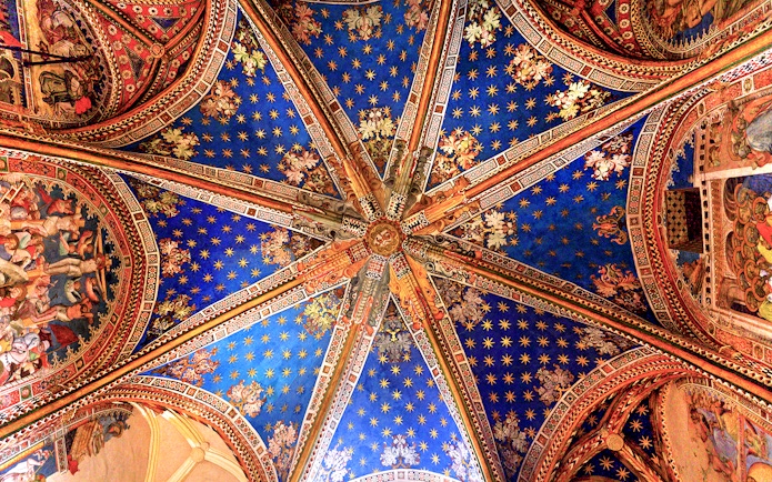 Ceiling artwork inside the Cathedral of Toledo during a guided tour.
