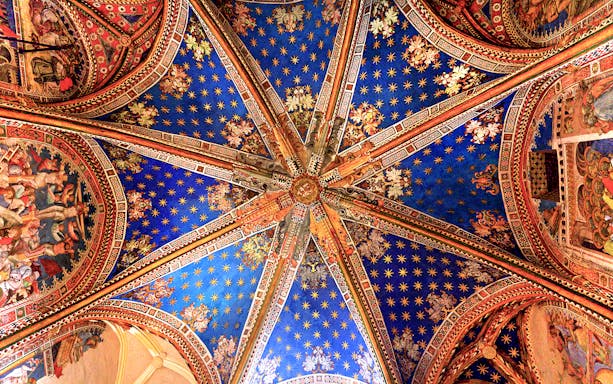 Ceiling artwork inside the Cathedral of Toledo during a guided tour.