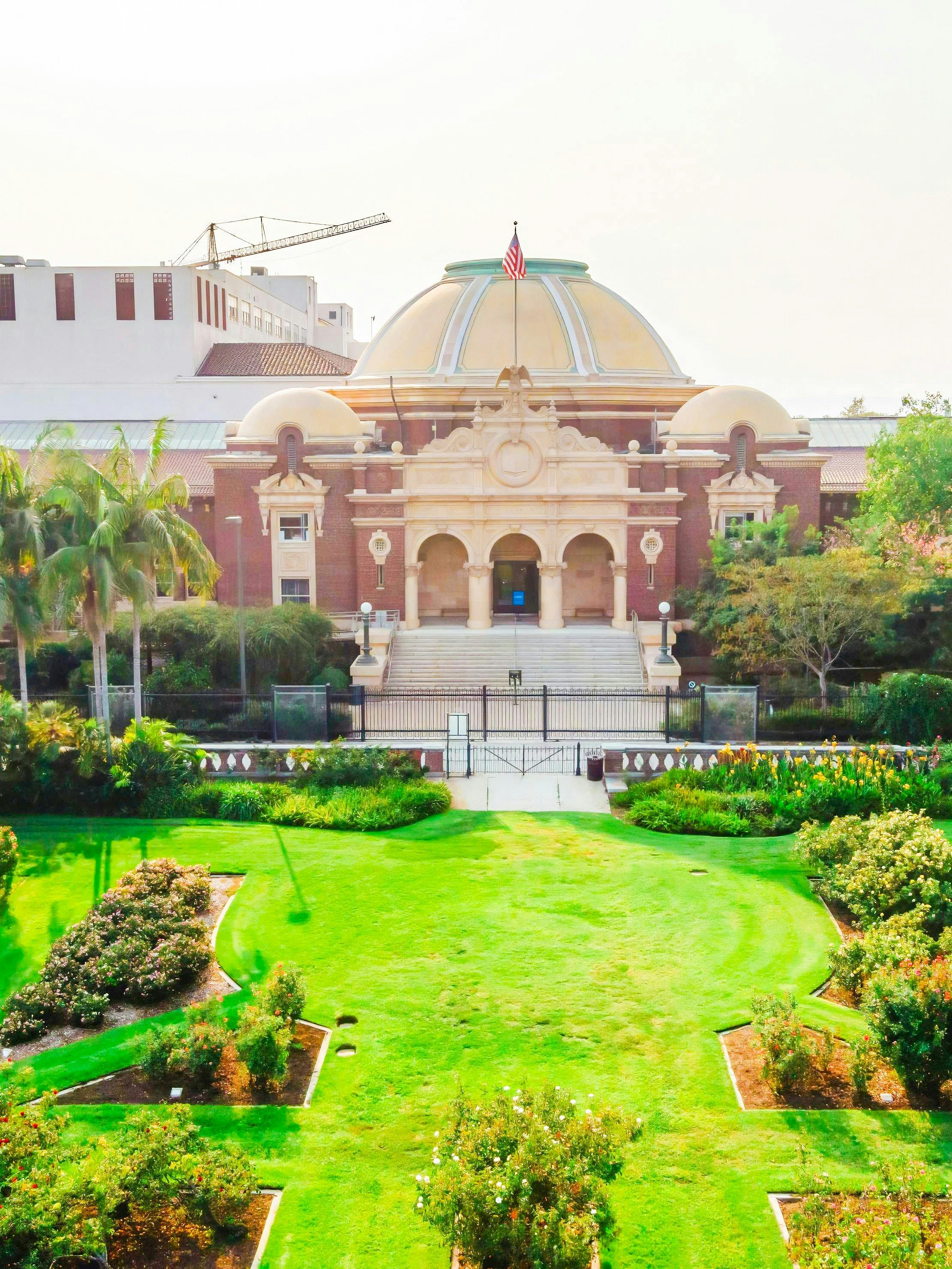 Natural History Museum of Los Angeles County entrance with gardens and dome.