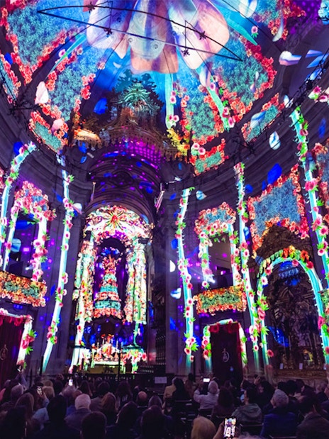 Colorful light projections inside Clérigos Church during Spiritus event, Porto.