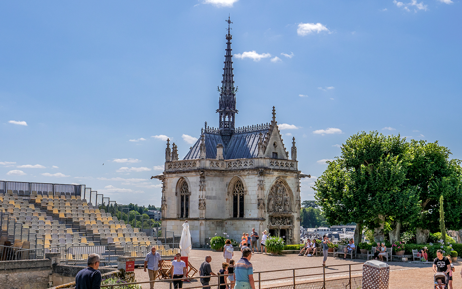 Royal Amboise Castle chapel with visitors and seating area in the foreground.