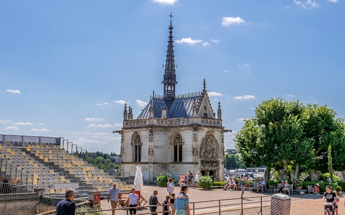 Royal Amboise Castle chapel with visitors and seating area in the foreground.