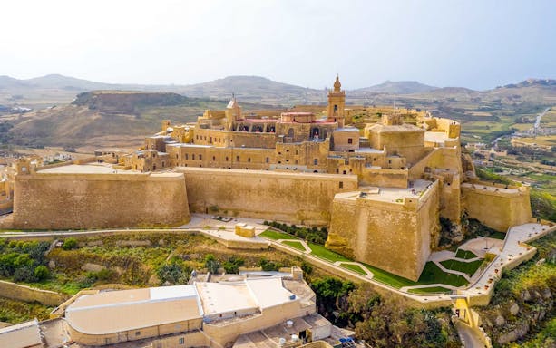 Aerial view of the Citadel in Gozo, Malta, surrounded by countryside.