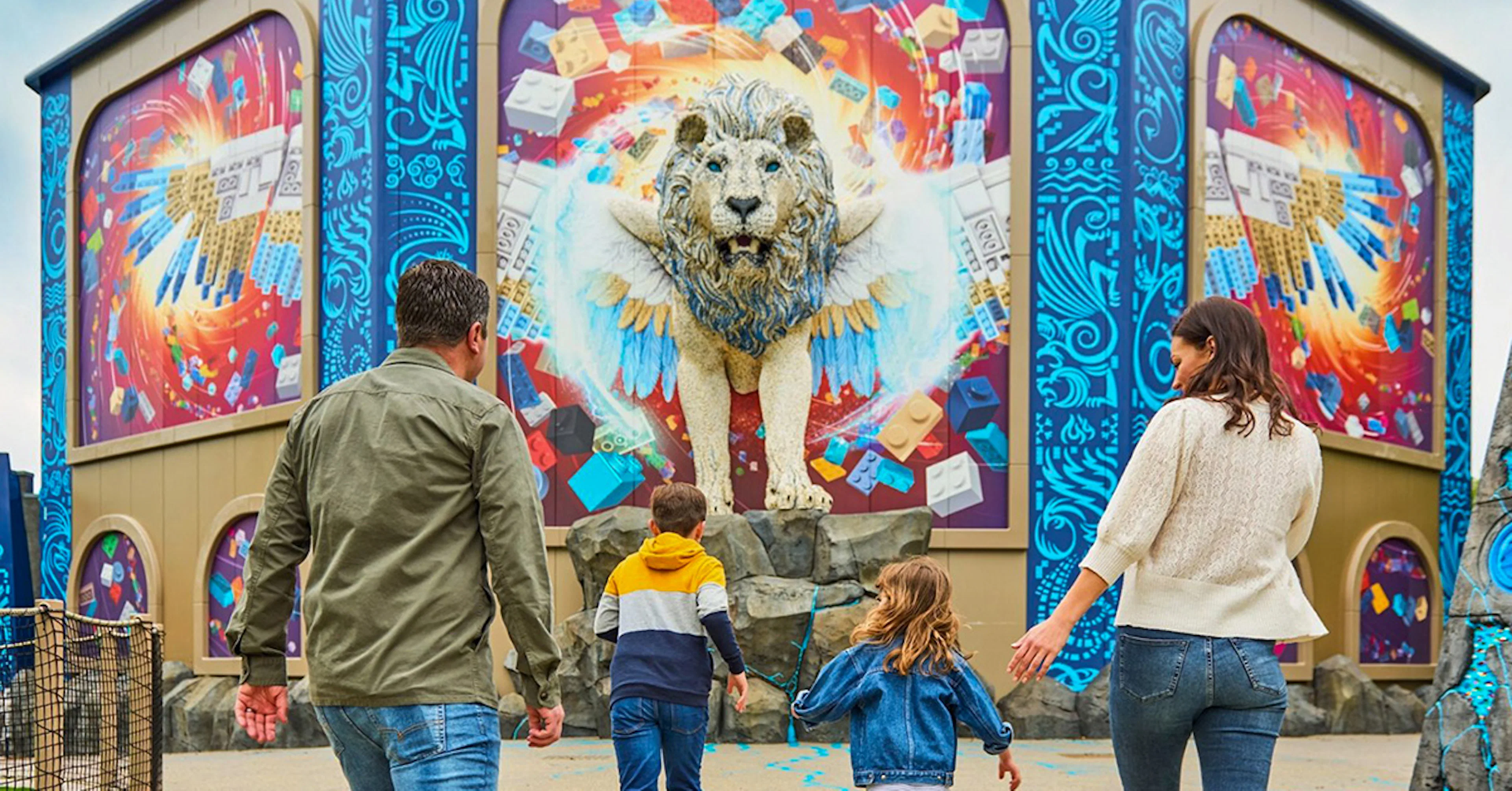 Guests approaching a winged lion sculpture at Legoland Windsor.