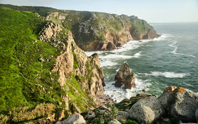 Cabo da Roca cliffs and Atlantic Ocean waves near Sintra, Portugal.