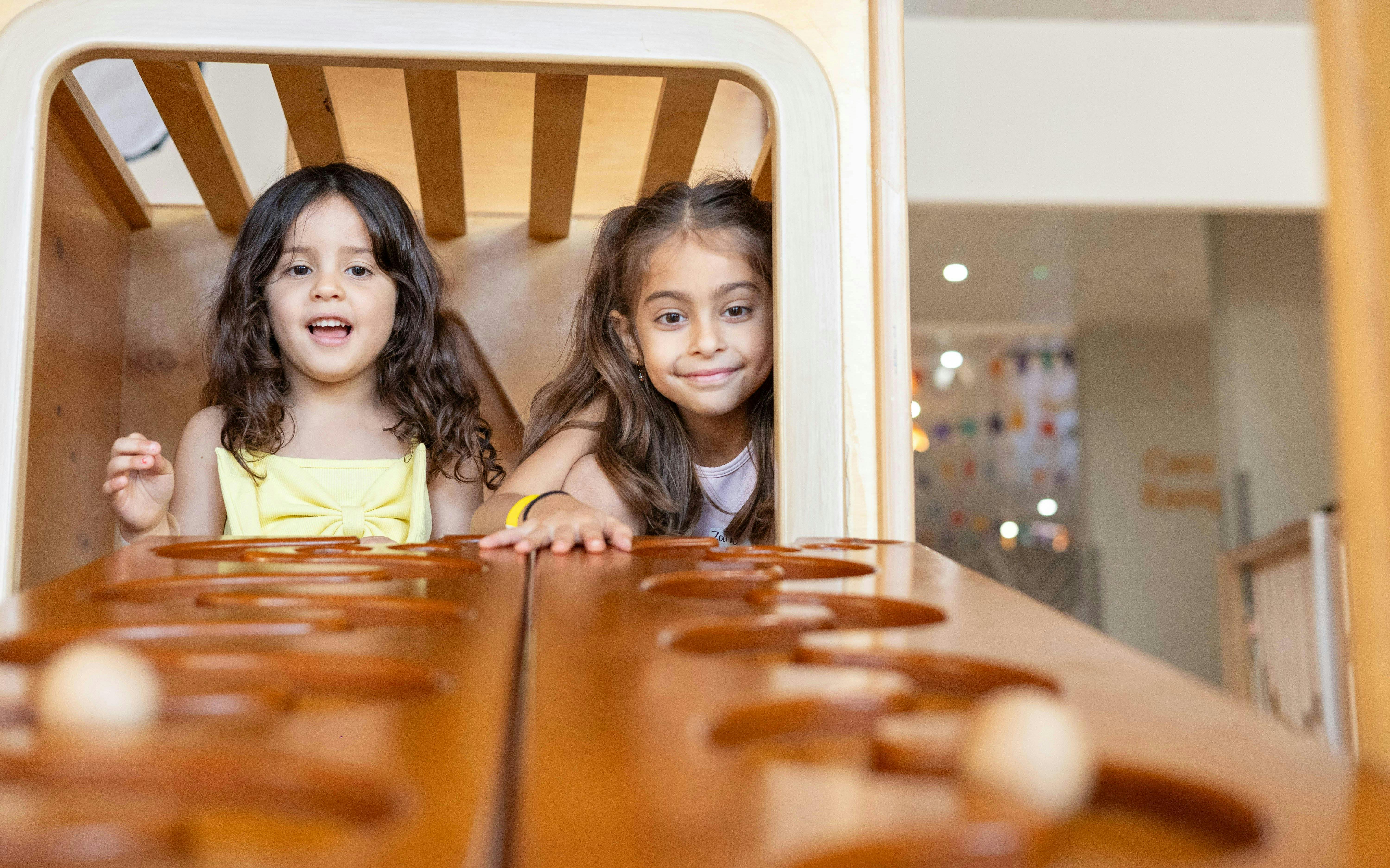 Children playing at OliOli Children's Museum interactive exhibit.