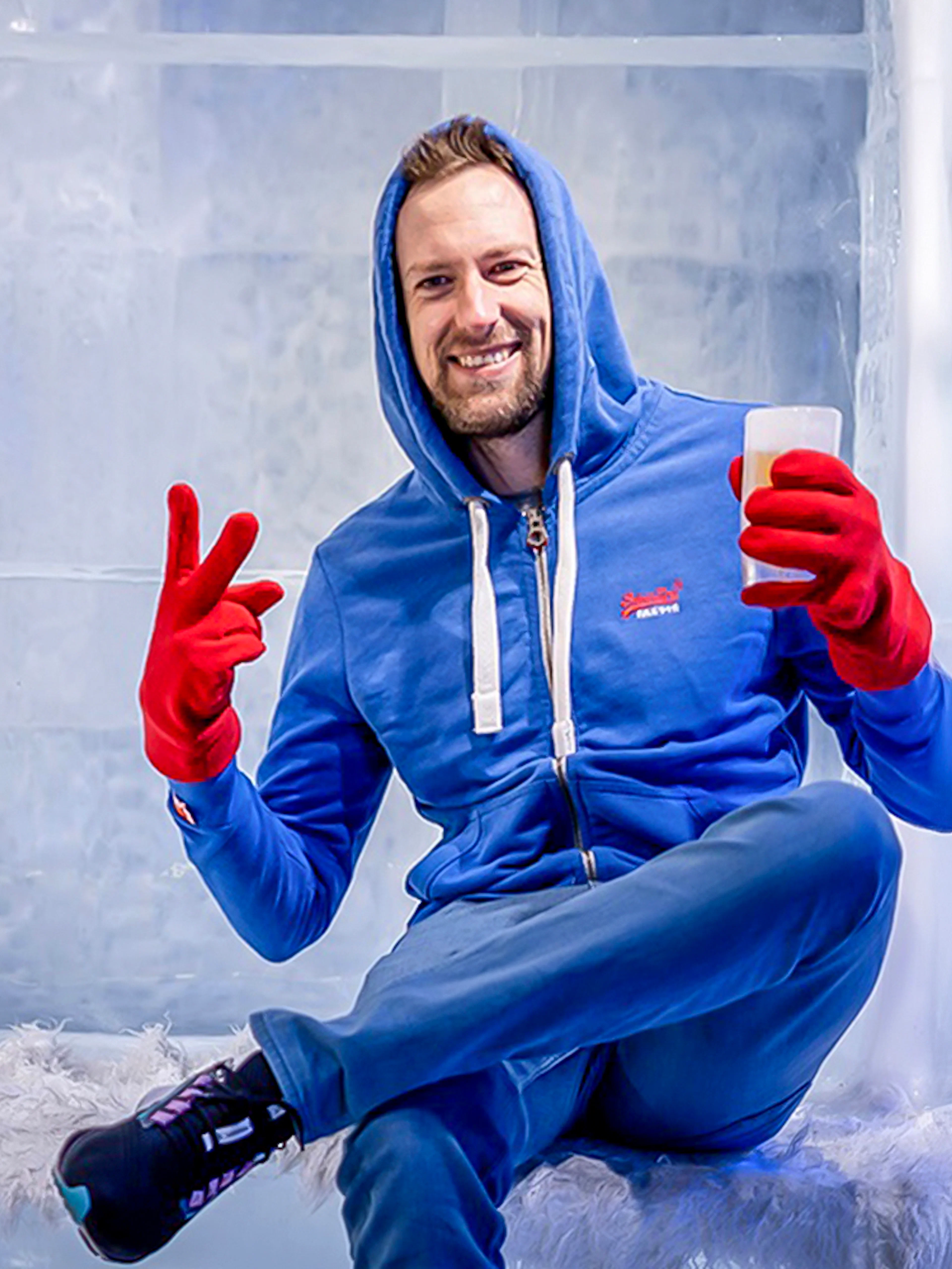 Guest relaxing with a drink at the Berlin Icebar.