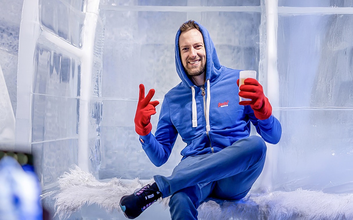 Guest relaxing with a drink at the Berlin Icebar.