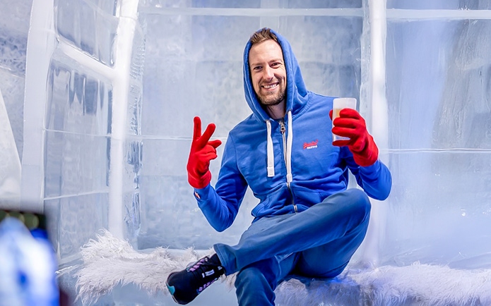 Guest relaxing with a drink at the Berlin Icebar.