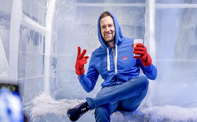Guest relaxing with a drink at the Berlin Icebar.