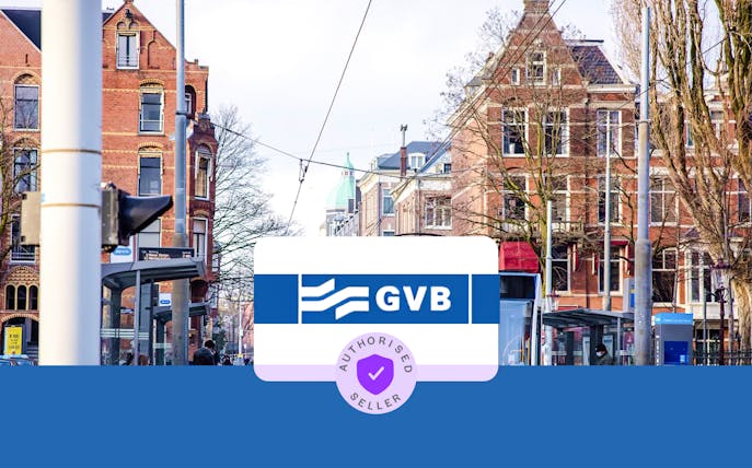 Tram stop in Amsterdam with GVB sign and historic buildings in the background.