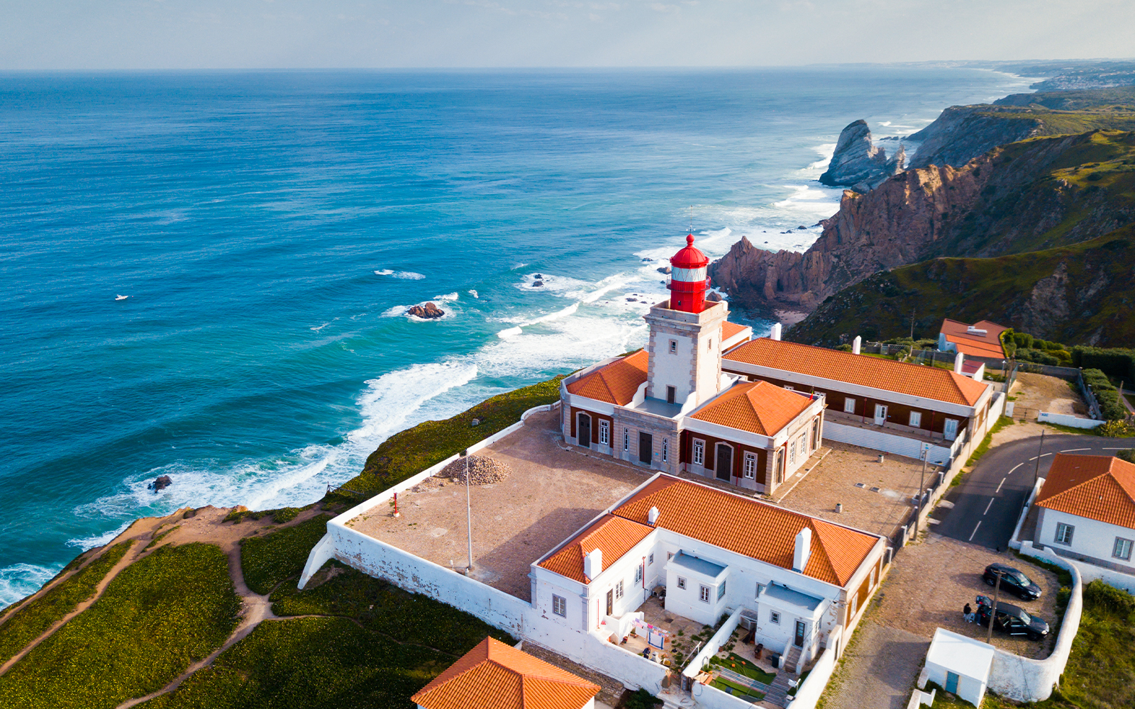 Cabo da Roca lighthouse on cliffs overlooking the Atlantic Ocean in Portugal.