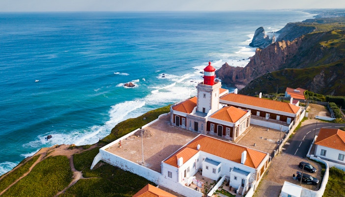 Cabo da Roca lighthouse on cliffs overlooking the Atlantic Ocean in Portugal.