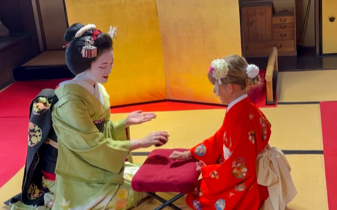 Geisha and Maiko in traditional attire during a cultural experience in Kyoto.